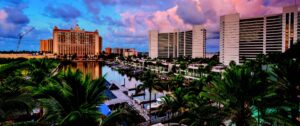 Densely packed waterfront residential area in Florida with boat docks and lush palm trees.